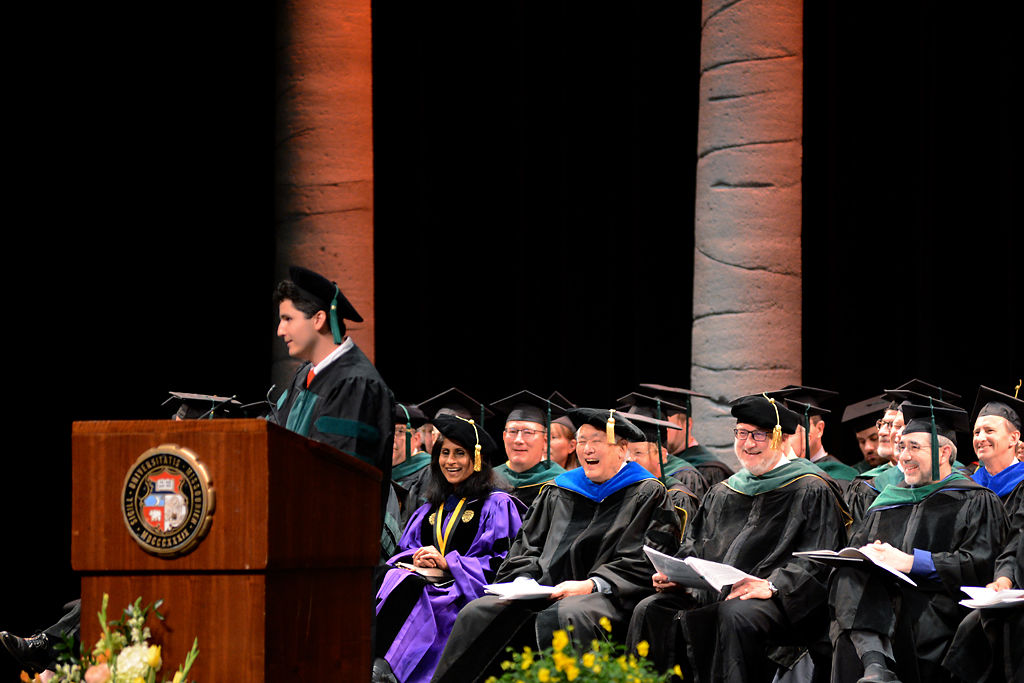 Aaron Dwan pauses after a joke during commencement